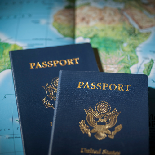 Two US Passport books on top of a map.