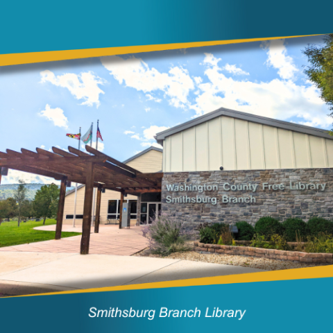 Smithsburg Branch Library building with wooden pergola in front and flags flying.