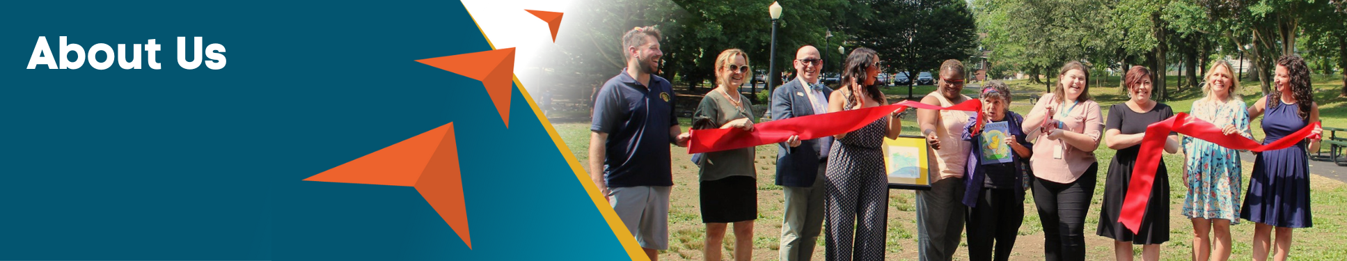 About Us Banner with three orange arrows pointing to group of adults cutting red ribbon.